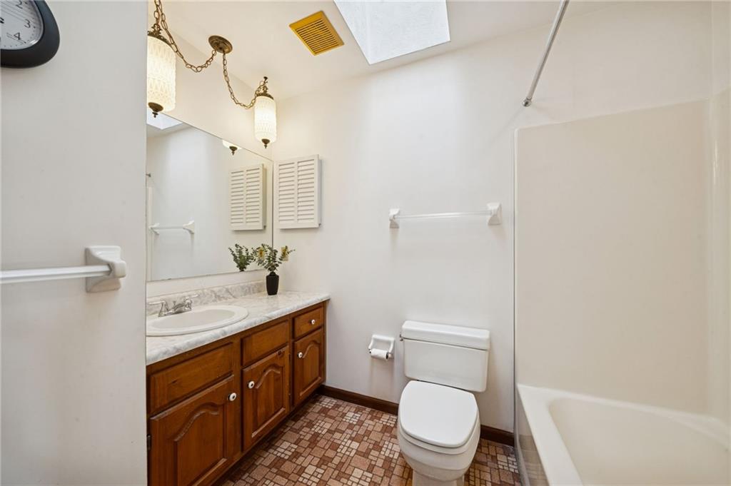2530 Pleasant Valley Road Murrysville, PA 15668 - Photo 23 of 33 a bathroom with a toilet sink and mirror