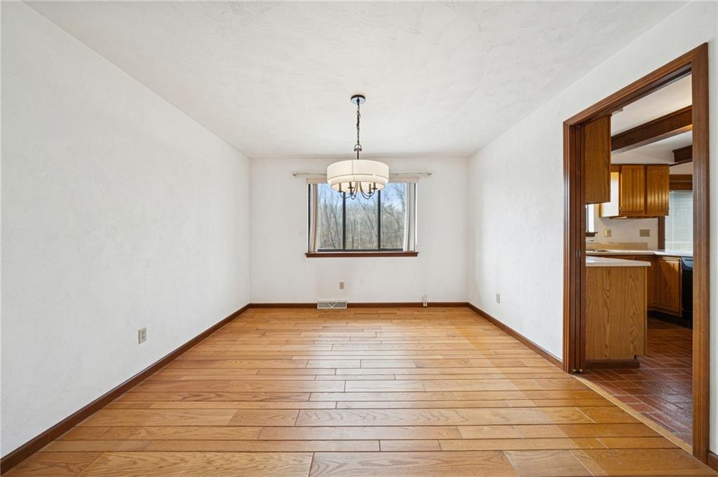 2530 Pleasant Valley Road Murrysville, PA 15668 - Photo 9 of 33 wooden floor in an empty room with a window