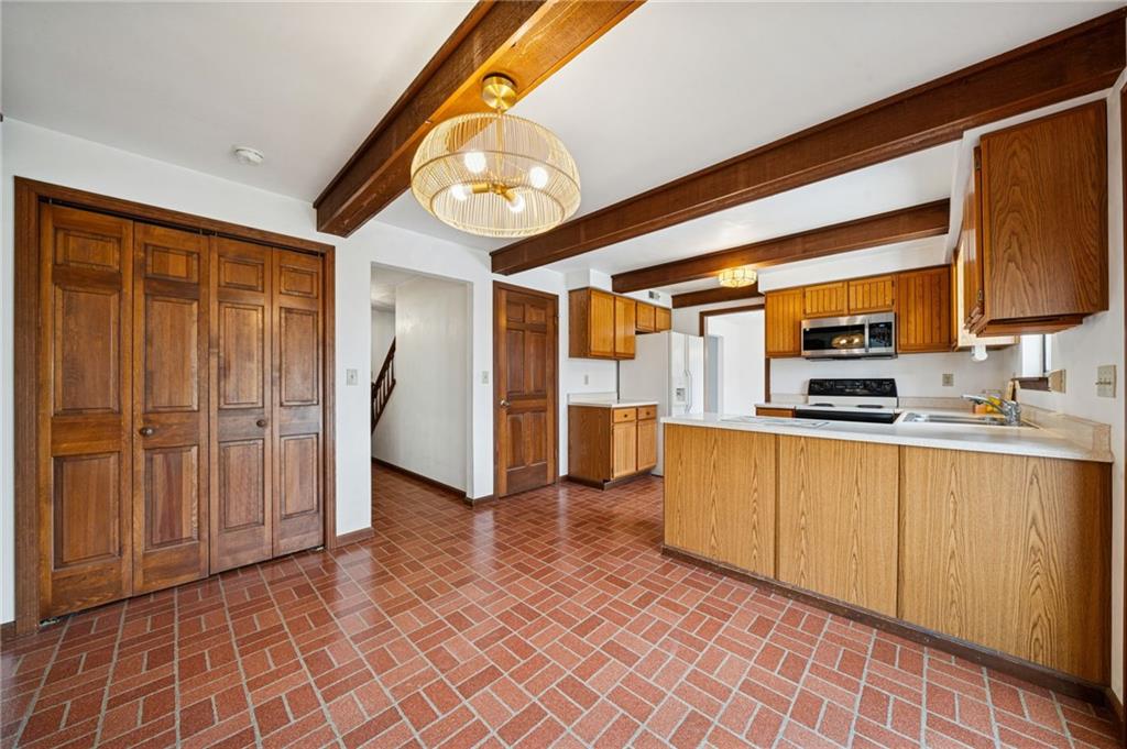2530 Pleasant Valley Road Murrysville, PA 15668 - Photo 10 of 33 a kitchen with stainless steel appliances granite countertop a refrigerator and a stove top oven