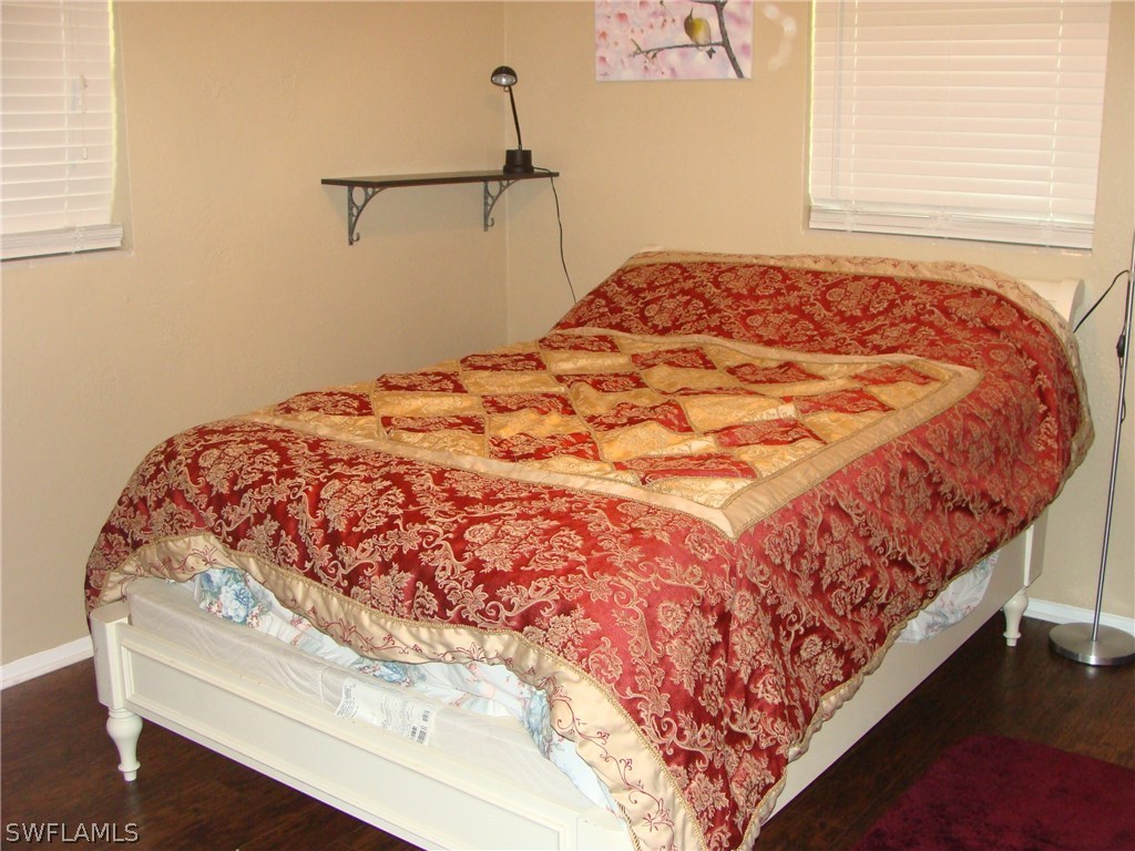 1455 Mandel Road Fort Myers, FL 33919 - Photo 6 of 17 a bedroom with a bed and a window