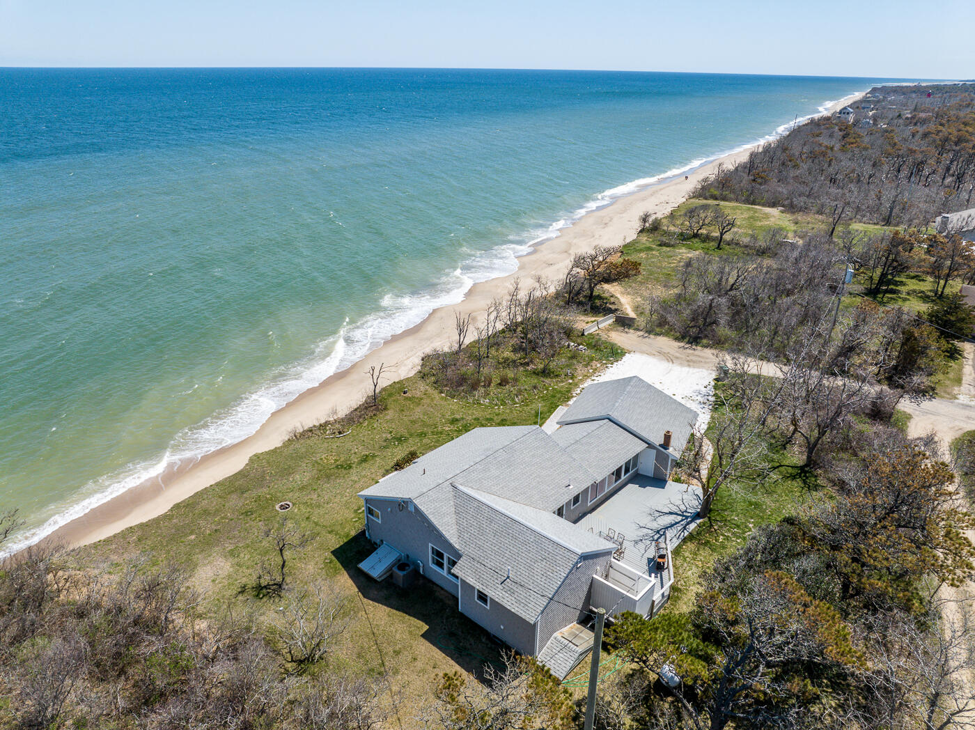 157 Brownell Road Eastham, MA 02642 - Photo 1 of 45 a view of a lake with a yard