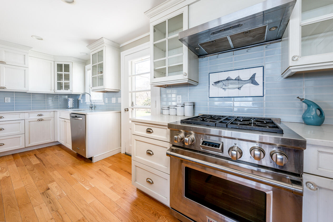 157 Brownell Road Eastham, MA 02642 - Photo 11 of 45 a kitchen with a stove and white cabinets