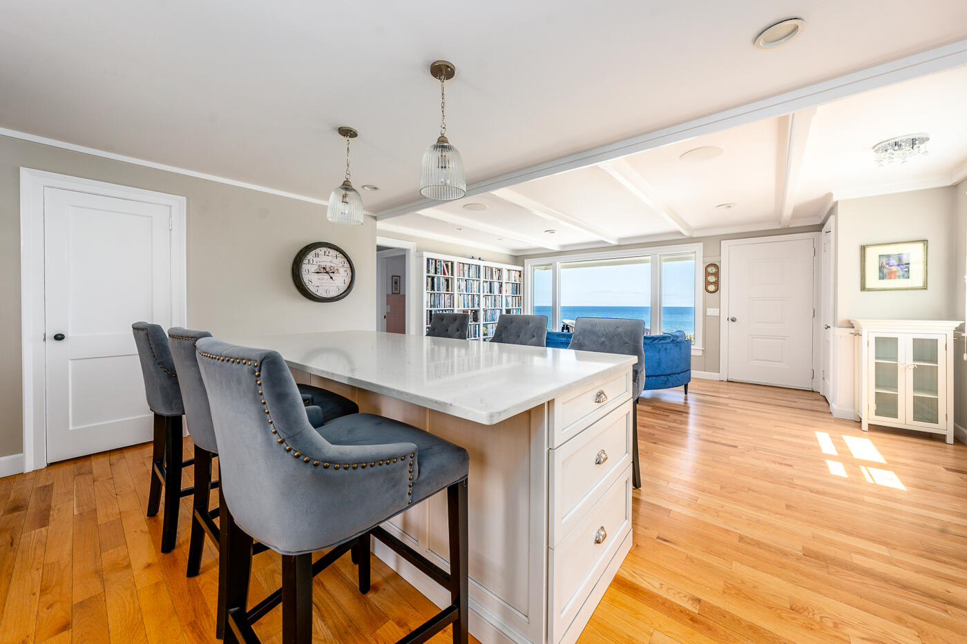 157 Brownell Road Eastham, MA 02642 - Photo 15 of 45 a view of a kitchen with a dining table and chairs