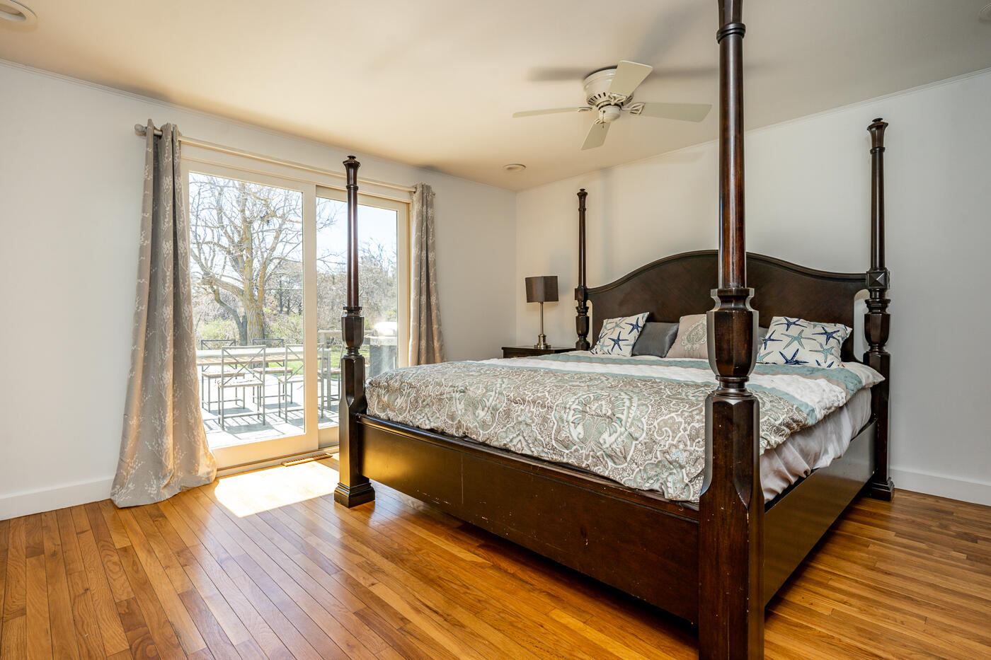 157 Brownell Road Eastham, MA 02642 - Photo 24 of 45 a bedroom with a large bed and wooden floor