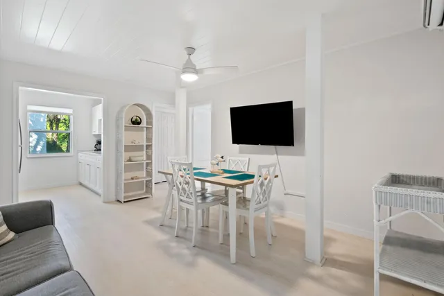 a view of a livingroom with furniture and a flat screen tv
