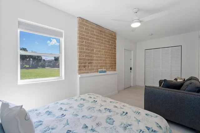 a bedroom with a bed and couch