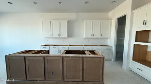 a kitchen with stainless steel appliances granite countertop a stove and a refrigerator