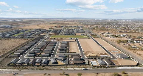 an aerial view of residential building with lake view