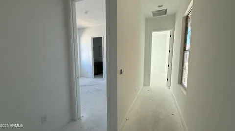 a view of a bathroom from a hallway