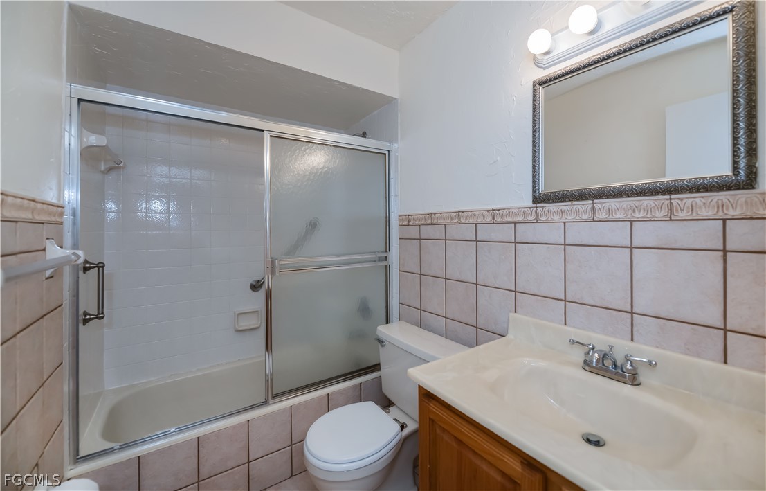 1100 Pondella Road, Unit 514 Cape Coral, FL 33909 - Photo 24 of 34 a bathroom with a sink toilet and shower