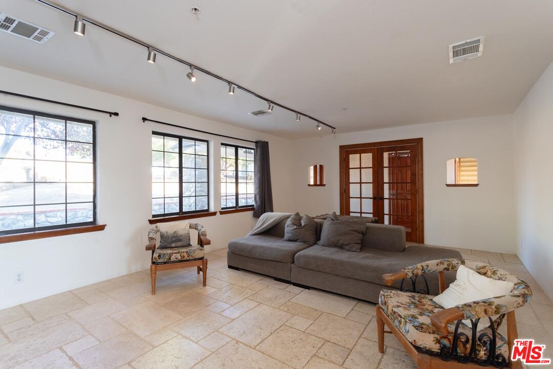 29243 Piani Road Pearblossom, CA 93553 - Photo 14 of 64 a living room with furniture and a window
