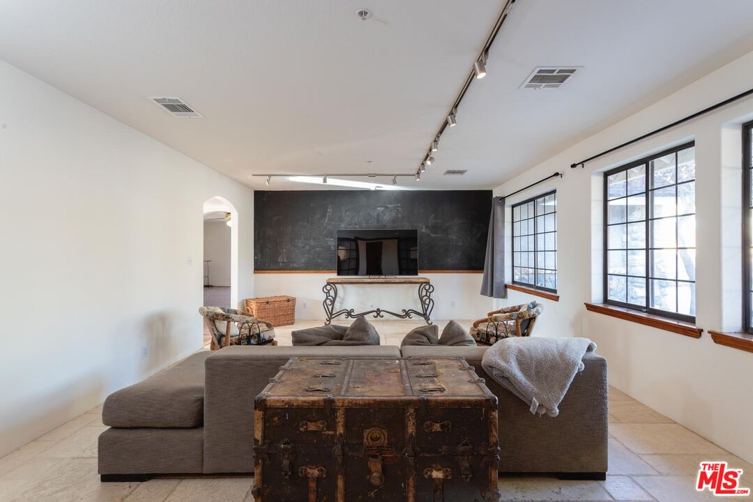 29243 Piani Road Pearblossom, CA 93553 - Photo 16 of 64 a living room with furniture and a window