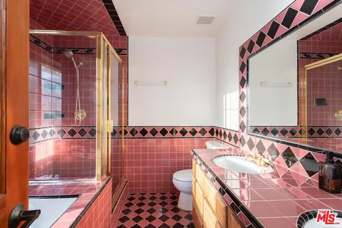 a bathroom with a bathtub and shower