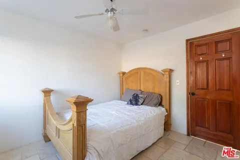 a bedroom with a bed and a closet