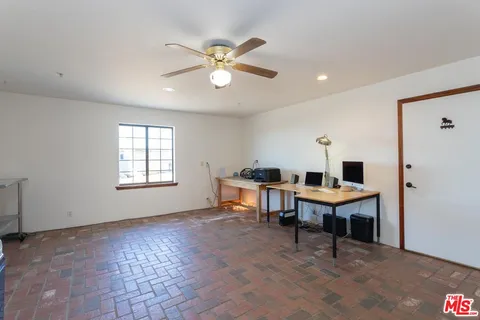 a workspace with furniture and window