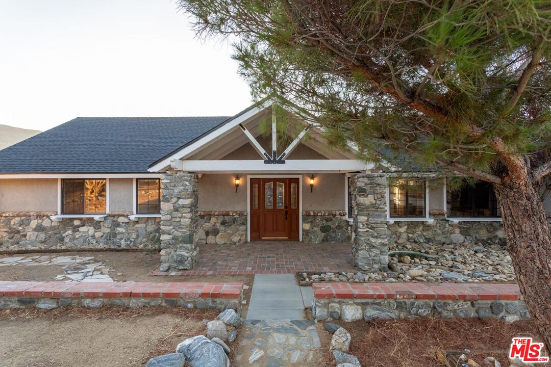 29243 Piani Road Pearblossom, CA 93553 - Photo 3 of 64 a front view of a house with garden