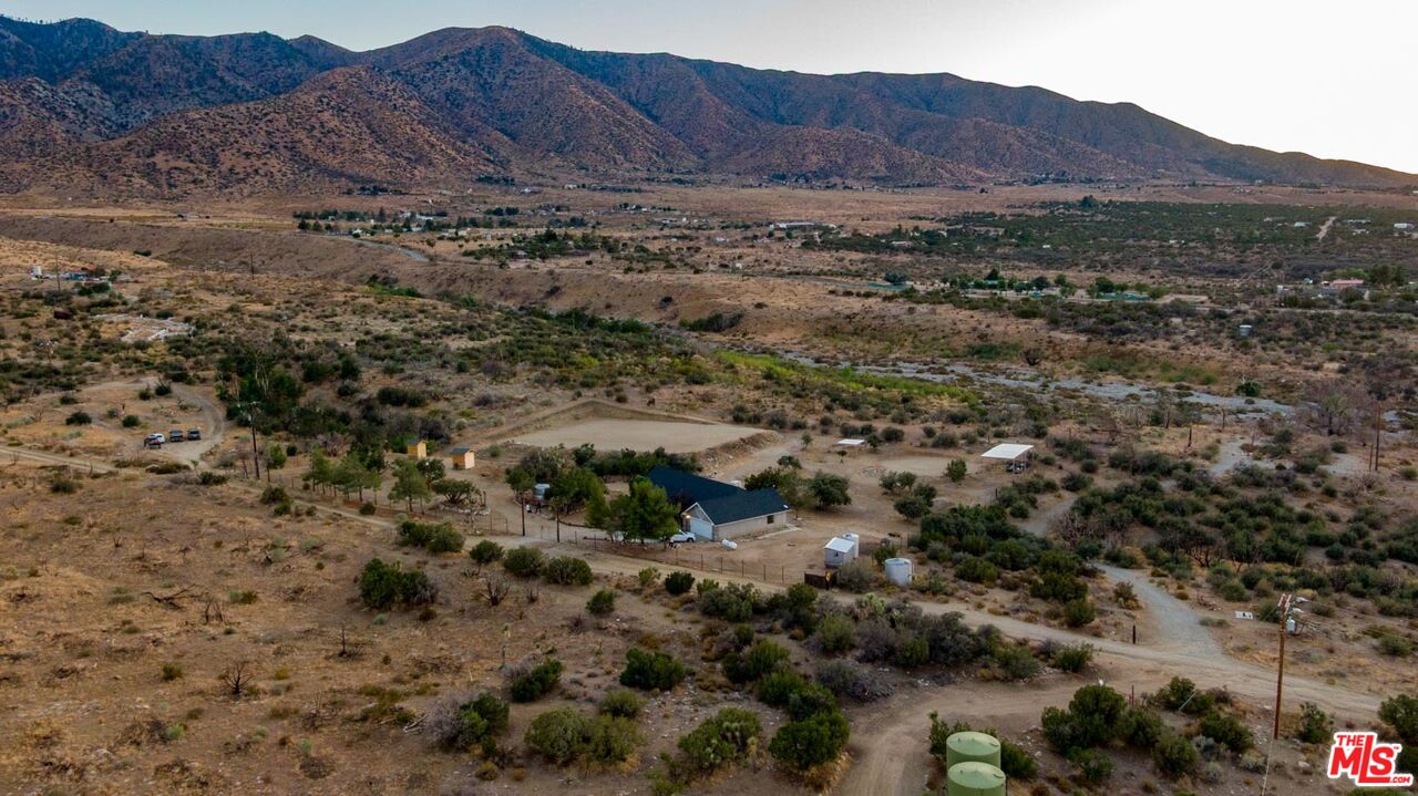 29243 Piani Road Pearblossom, CA 93553 - Photo 43 of 64 a view of a lush green hillside and a building
