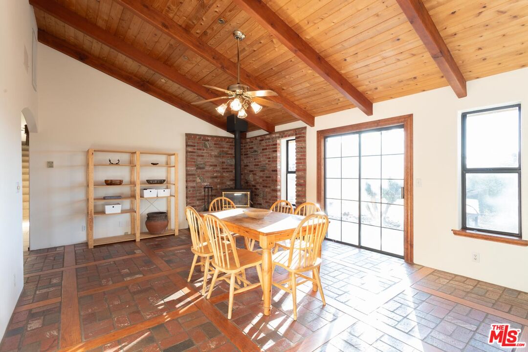 29243 Piani Road Pearblossom, CA 93553 - Photo 8 of 64 a view of a dining room with furniture and a chandelier