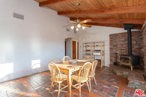a dining room with furniture and chandelier