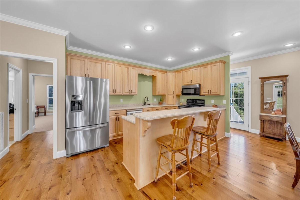 131 Butterfly Lane Bell Buckle, TN 37020 - Photo 13 of 46 a kitchen with stainless steel appliances granite countertop a refrigerator stove top oven and sink
