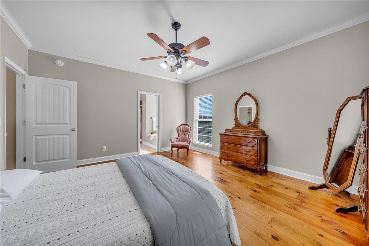 131 Butterfly Lane Bell Buckle, TN 37020 - Photo 21 of 46 a bedroom with a bed and a chandelier