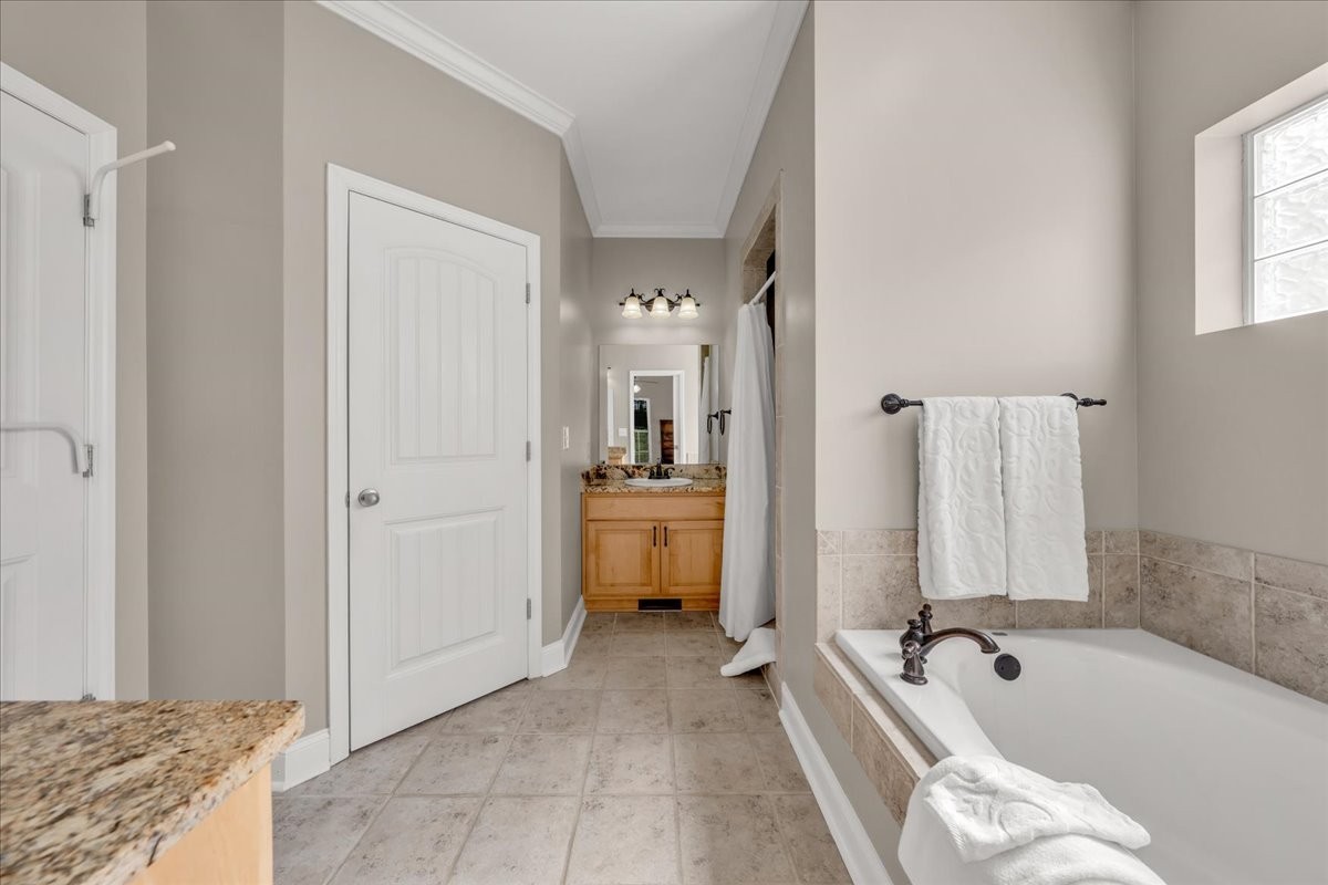 131 Butterfly Lane Bell Buckle, TN 37020 - Photo 22 of 46 a spacious bathroom with a tub sink and mirror