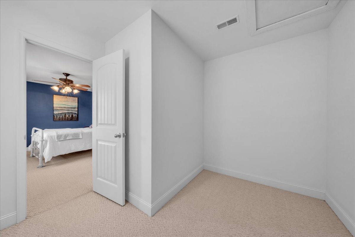 131 Butterfly Lane Bell Buckle, TN 37020 - Photo 29 of 46 a view of a bedroom with a bed and a couch