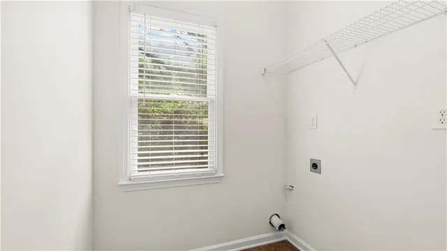 a kitchen with stainless steel appliances granite countertop a stove a sink and a refrigerator with wooden floors