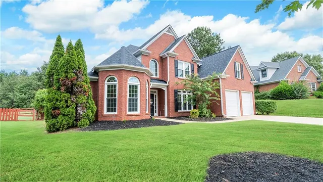 a front view of a house with garden