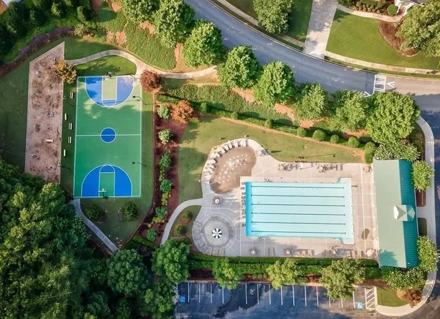 an aerial view of swimming pool yard and outdoor seating