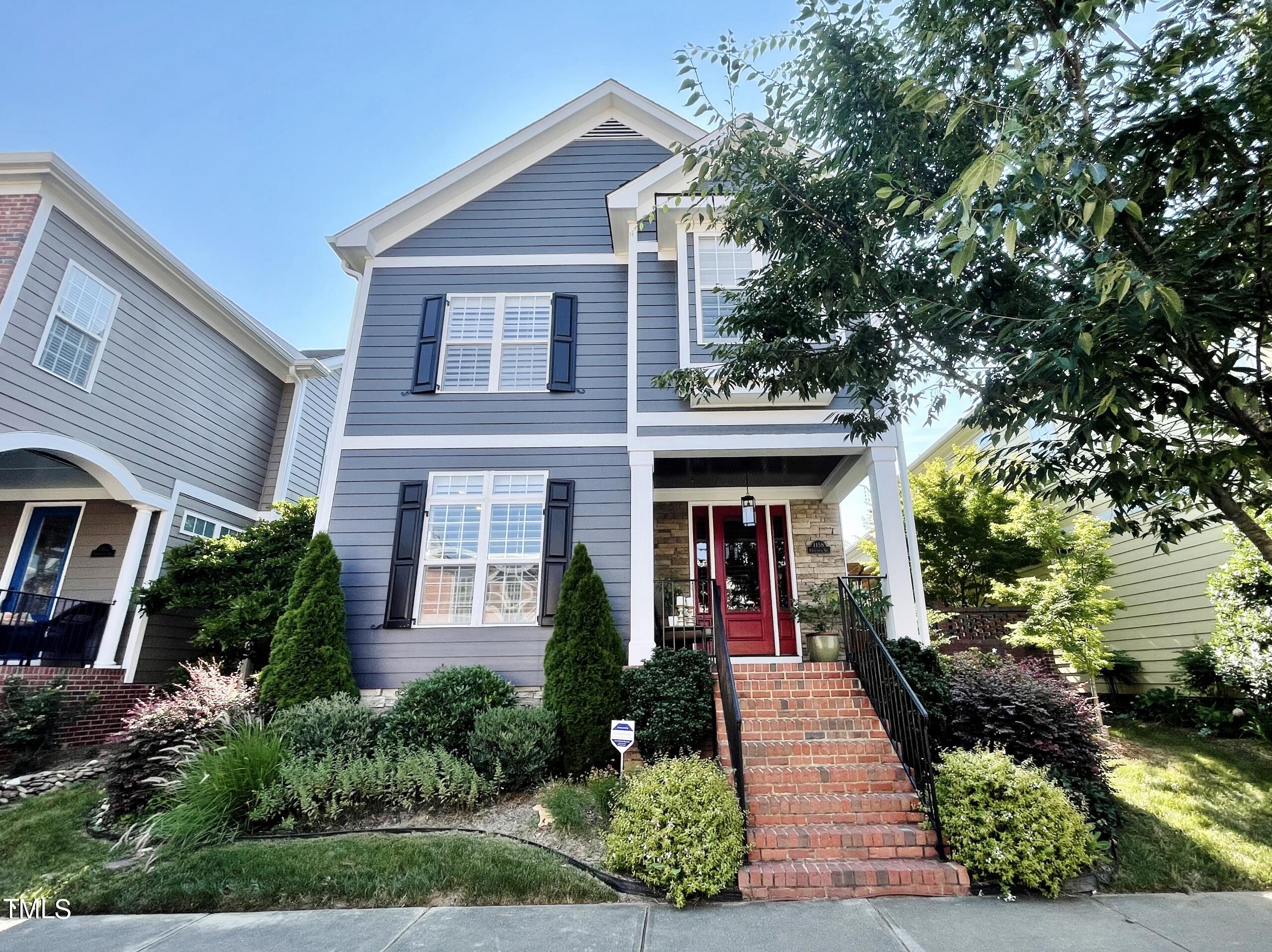 1158 Haynes Street Raleigh, NC 27604 - Photo 1 of 36 a front view of a house with a porch
