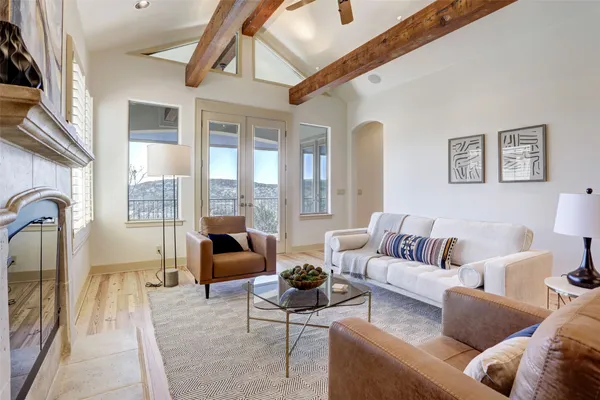 a living room with furniture and a large window