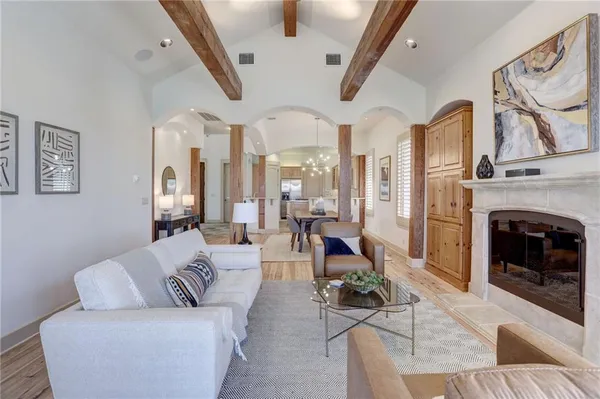 a living room with furniture or chandelier and a fireplace