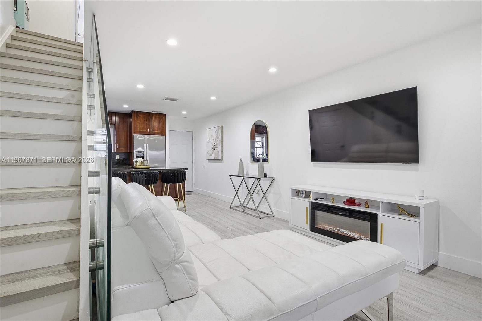11781 Southwest 18th Street, Unit 640 Miami, FL 33175 - Photo 11 of 32 a living room with furniture and a flat screen tv