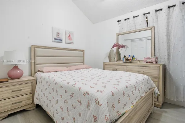 a bedroom with a bed and a cabinets