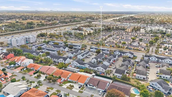an aerial view of residential building and lake