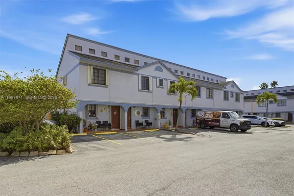 a view of a car park in front of building