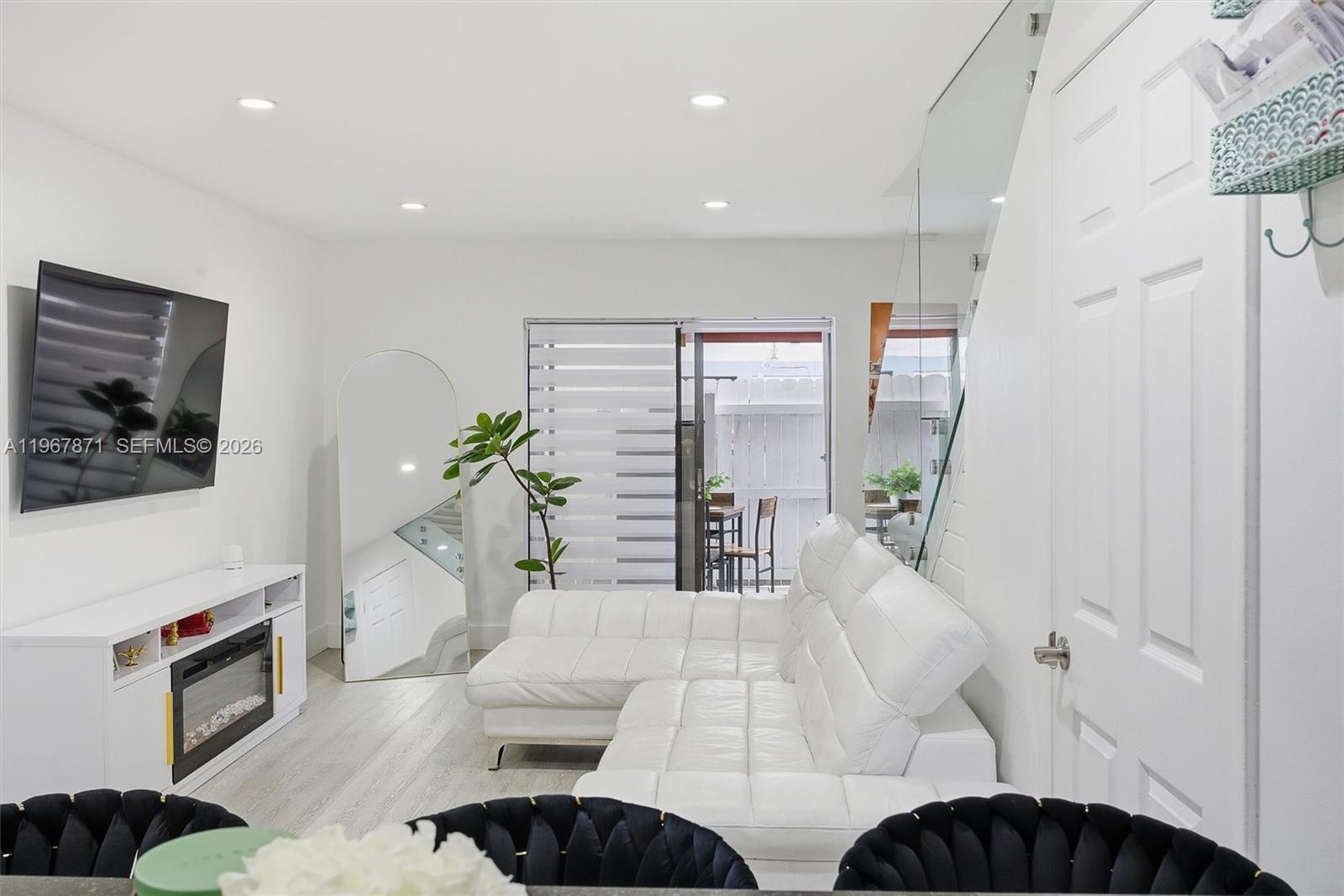11781 Southwest 18th Street, Unit 640 Miami, FL 33175 - Photo 6 of 32 a living room with furniture and a potted plant