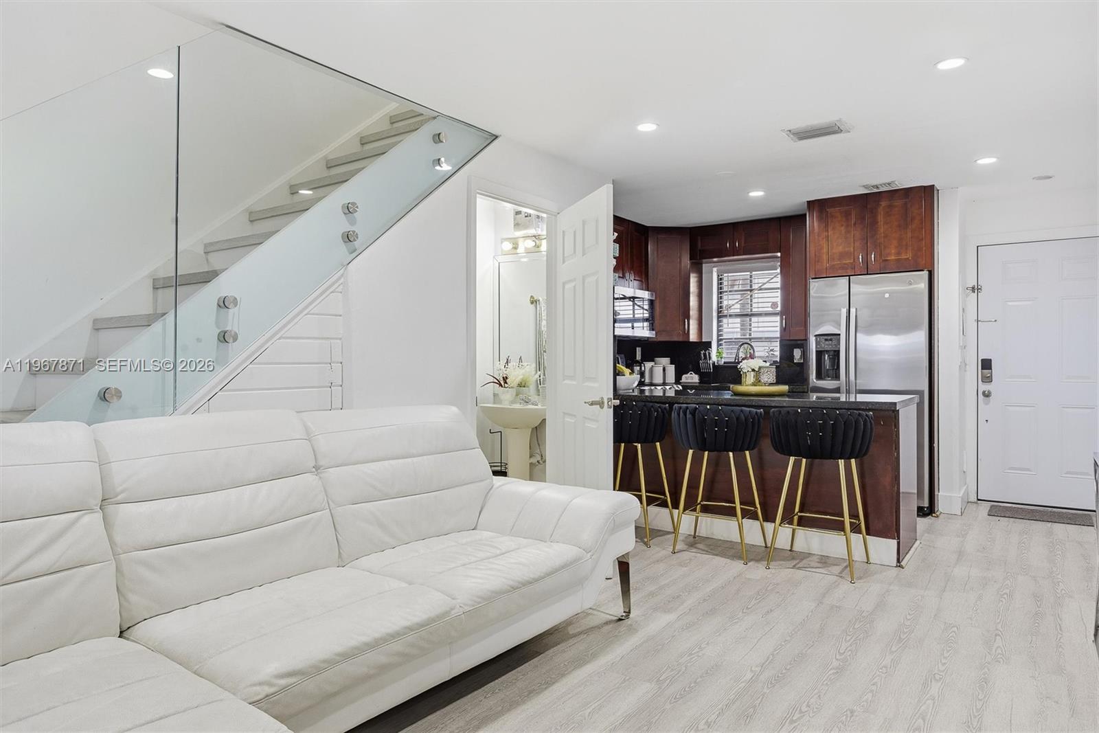 11781 Southwest 18th Street, Unit 640 Miami, FL 33175 - Photo 10 of 32 a living room with furniture and a dining table with wooden floor
