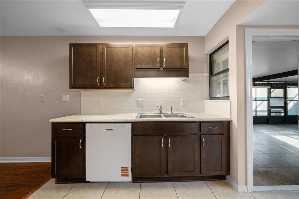 3702 Northeast 17th Street Ocala, FL 34470 - Photo 13 of 63 a kitchen with a sink and cabinets