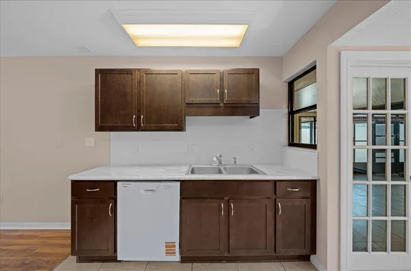 a view of empty room with windows