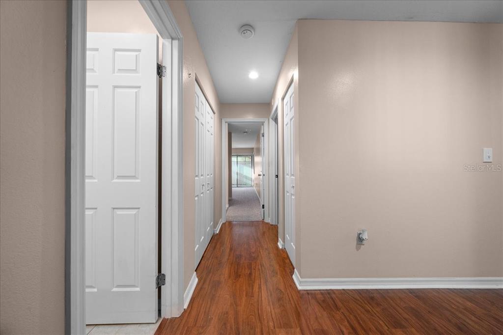 3702 Northeast 17th Street Ocala, FL 34470 - Photo 19 of 63 a view of a hallway with wooden floor
