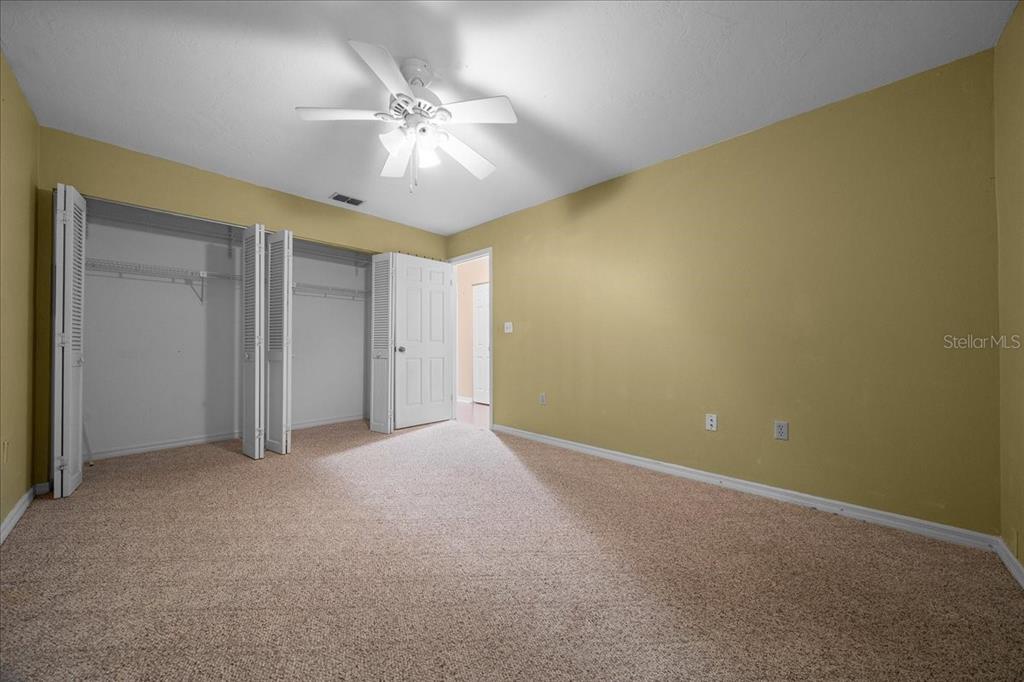 3702 Northeast 17th Street Ocala, FL 34470 - Photo 20 of 63 a view of an empty room with a chandelier fan