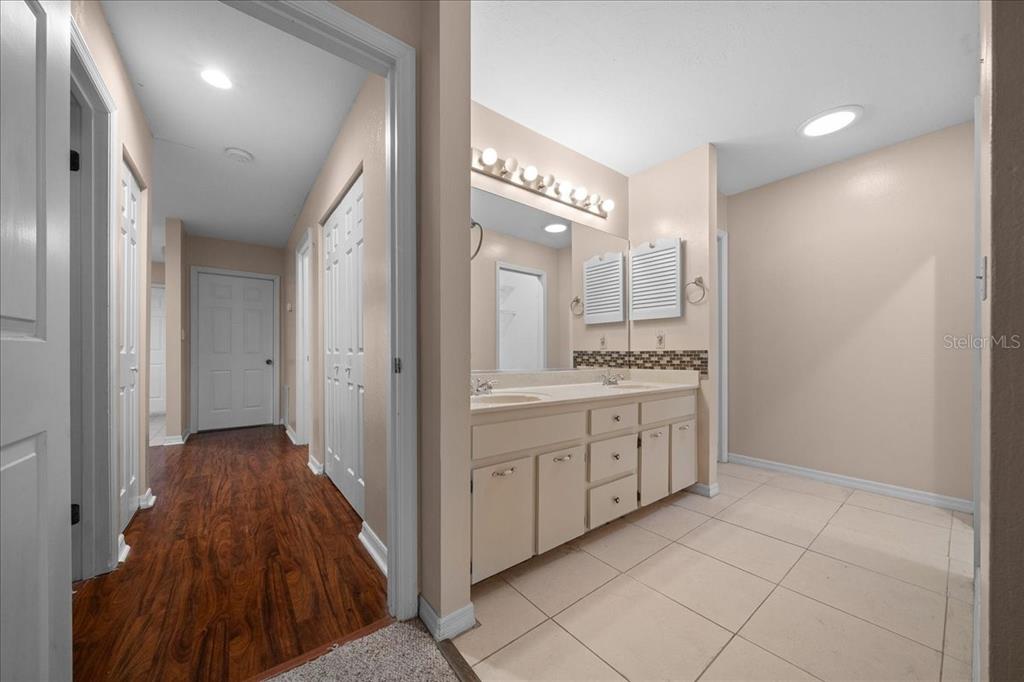 3702 Northeast 17th Street Ocala, FL 34470 - Photo 24 of 63 a bathroom with a sink a toilet and a mirror