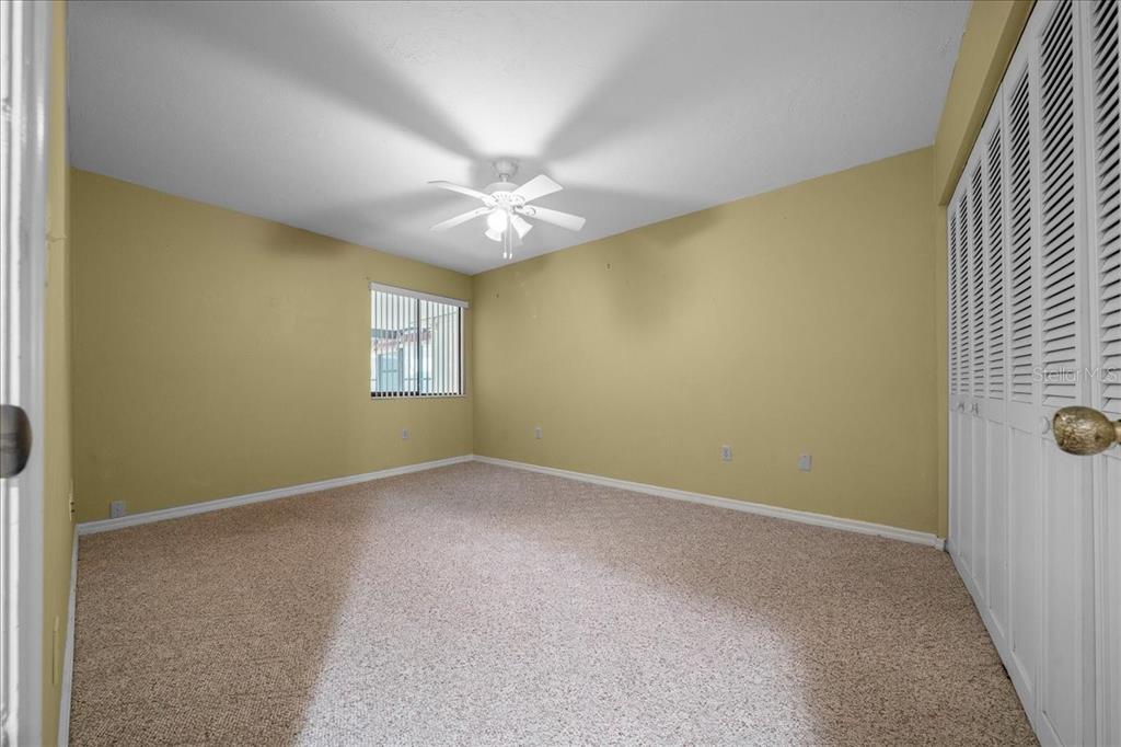 3702 Northeast 17th Street Ocala, FL 34470 - Photo 26 of 70 an empty room with windows and fan