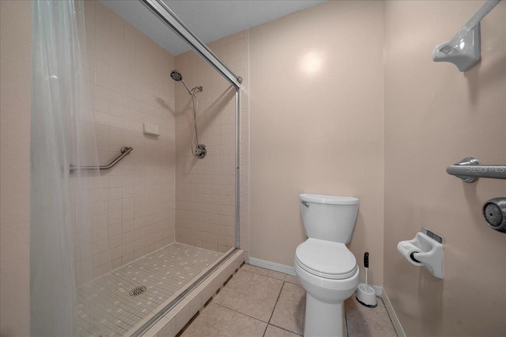 3702 Northeast 17th Street Ocala, FL 34470 - Photo 34 of 70 a bathroom with a toilet and a shower