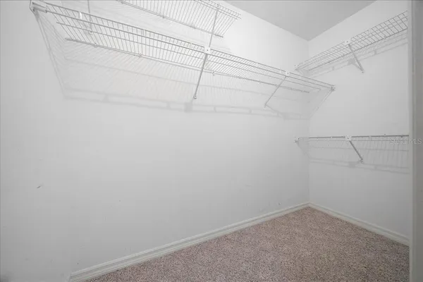 a front view of a house with a garden and yard