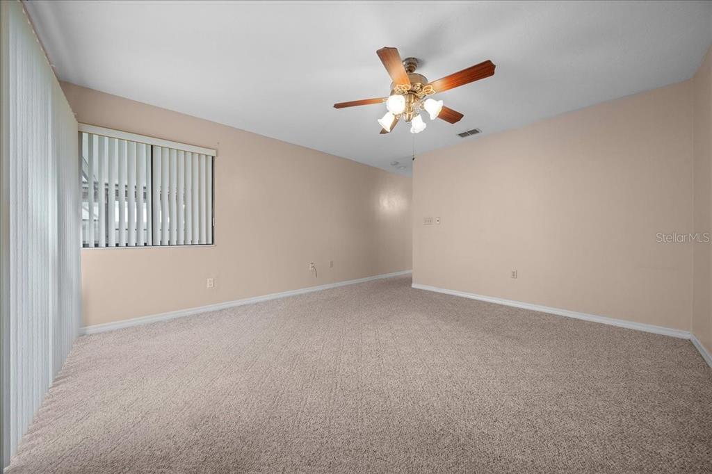 3702 Northeast 17th Street Ocala, FL 34470 - Photo 39 of 70 an empty room with windows and fan