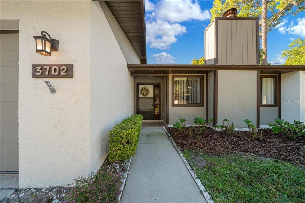 3702 Northeast 17th Street Ocala, FL 34470 - Photo 4 of 63 a front view of a house with garden