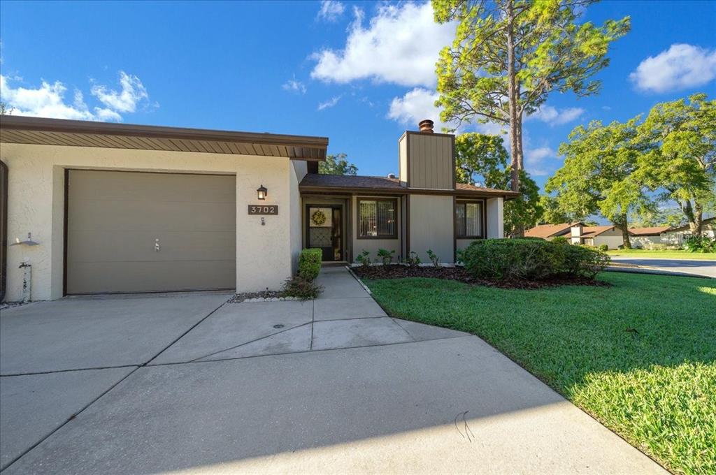 3702 Northeast 17th Street Ocala, FL 34470 - Photo 43 of 70 a front view of a house with a yard